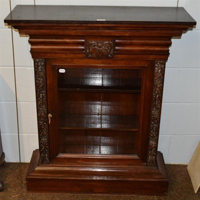 Lot 1249 - A 19th century carved rosewood pier cabinet, possibly Irish