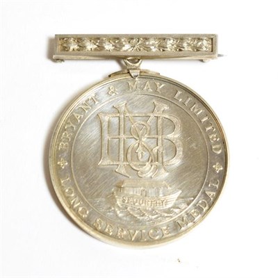 Lot 2013 - A Bryant & May Ltd. Long Service Silver Medal, the obverse with B & M monogram above an ark...