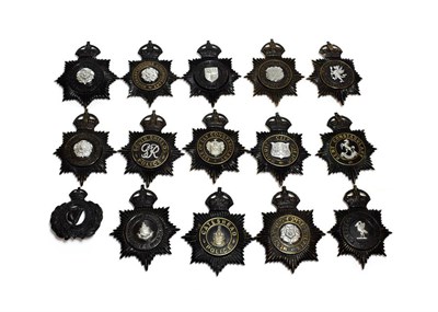 Lot 2073 - A Collection of Fourteen Pre-1953 British Police Night Helmet Plates, in two piece blackened brass