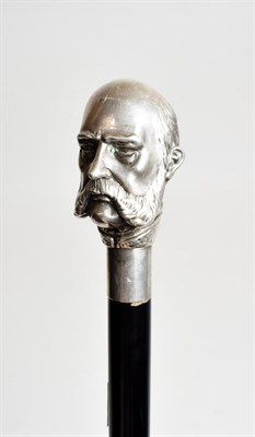 Lot 2108 - An Italian Ebonised Walking Cane, the large silver pommel modelled as the bust head of the...