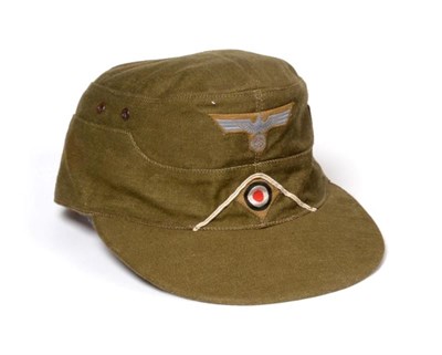 Lot 2159 - A German Third Reich EM's M41 Tropical Field Cap, in olive/khaki cotton, the front of the cap...