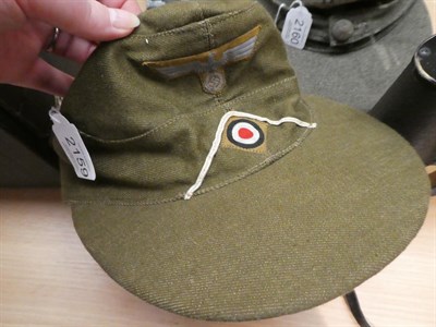 Lot 2159 - A German Third Reich EM's M41 Tropical Field Cap, in olive/khaki cotton, the front of the cap...