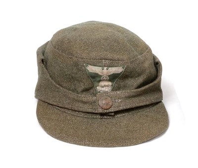 Lot 2160 - A German Third Reich SS EM's M43 Field Cap, in grey/green wool, with BeVo woven SS eagle and...