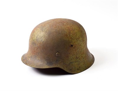 Lot 2175 - A German Third Reich M42 Steel Helmet, with sprayed pale green camouflage finish over the...