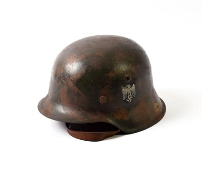 Lot 2176 - A German Third Reich M42 Single Decal Steel Helmet, with camouflaged finish of splashes of...