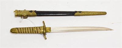 Lot 2199 - A Japanese Model 1883 Naval Dirk, the 21cm single edge steel blade with a narrow fuller to the back