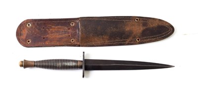 Lot 2213 - A Third Pattern Commando Knife, the associated 17.5cm double edge blackened steel blade with uneven