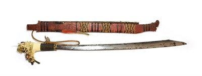 Lot 2269 - A Dyak Head Hunter's Mandau, with 57cm clip point steel blade, the bone hilt with woven brass grip