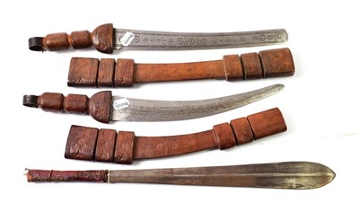 Lot 2274 - Two Tuareg Short Swords, each with curved double edge steel blade stamped with roundels and...