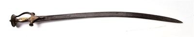 Lot 2275 - An 18th Century Indian Talwar, the 77cm single edge curved steel blade double edged for the...