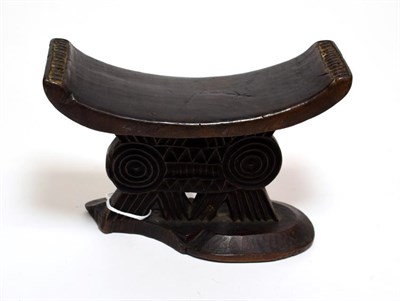 Lot 2288 - A Late 19th Century Shona Headrest, of dark patinated wood, the dished rectangular top with...