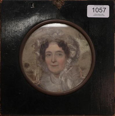 Lot 1057 - Follower of Sir Thomas Lawrence PRA FRS (1769-1830)  Portrait of a lady wearing a lace trimmed...