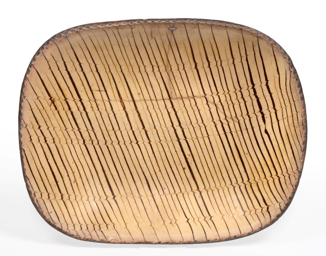 Lot 1 - A Staffordshire Slipware Dish, 18th century, of rounded rectangular form with pie crust rim,...
