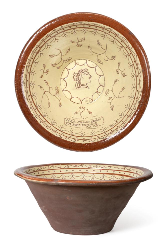 Lot 2 - A Yorkshire Slipware Dairy Bowl, dated 1877, inscribed MRS ENSEN LUCAS CASTLEFORD 1877 and...