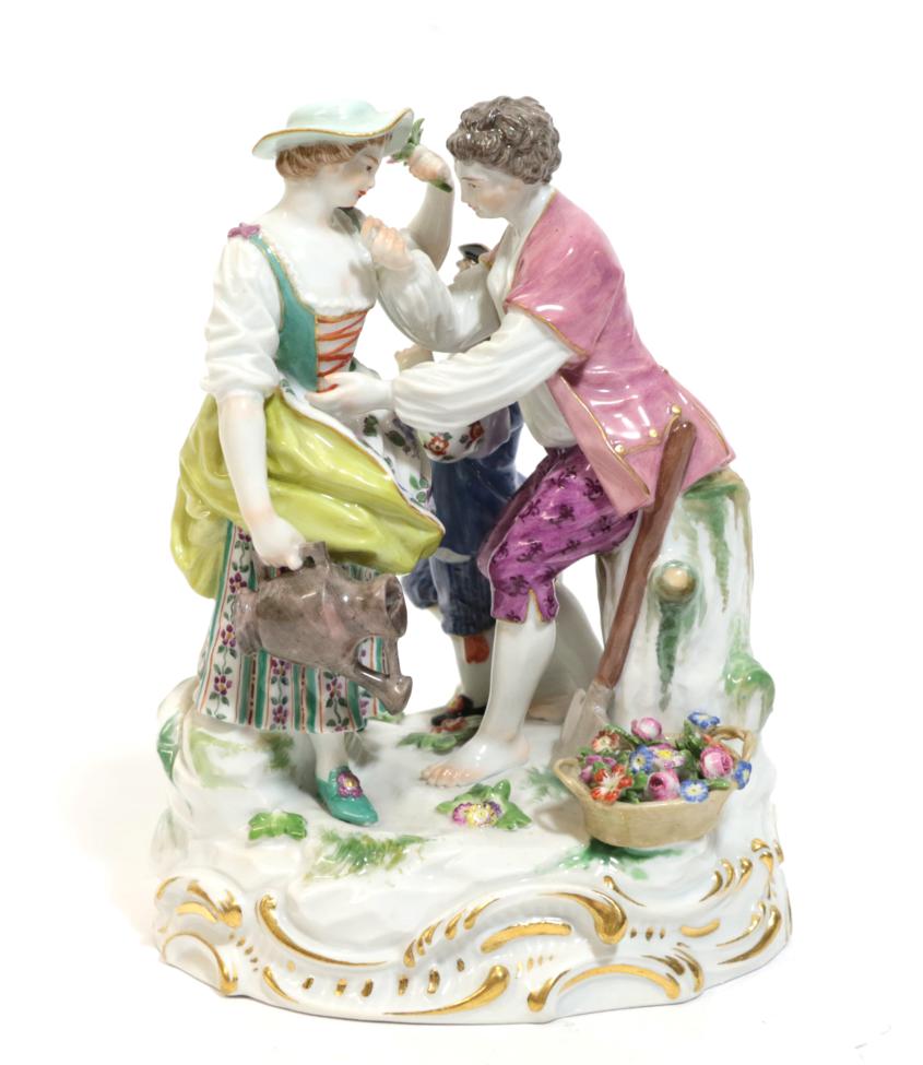 Lot 12 - A Meissen Porcelain Figure Group, late 19th/early 20th century, modelled as a gardener and...