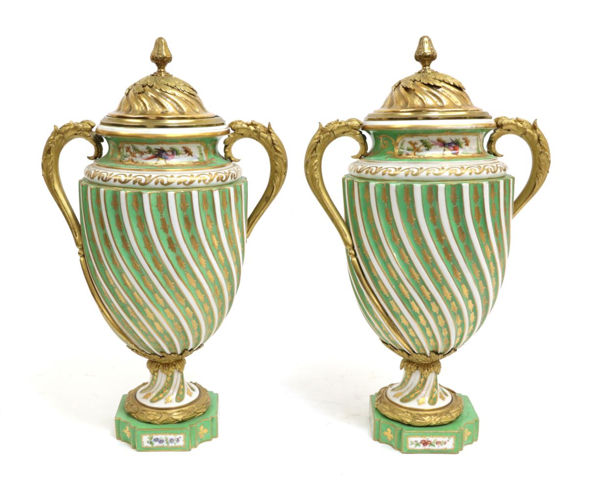 Lot 17 - A Pair of Gilt Metal Sèvres Style Porcelain Vases and Covers, circa 1900, of wrythen fluted...