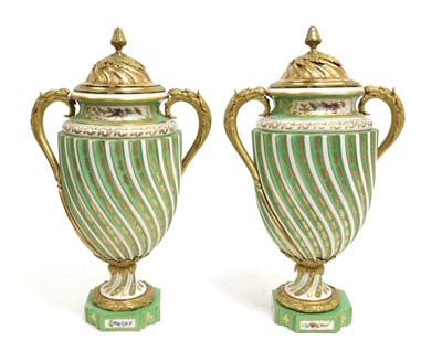 Lot 17 - A Pair of Gilt Metal Sèvres Style Porcelain Vases and Covers, circa 1900, of wrythen fluted...