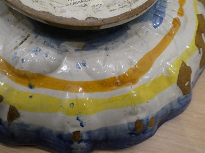 Lot 20 - A Faenza Maiolica Crespina, circa 1550, of lobed circular form, painted in colours with a recumbent