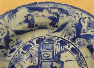 Lot 34 - A Chinese Kraak Porcelain Charger, 17th century, painted in underglaze blue with figures in a...