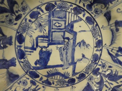Lot 34 - A Chinese Kraak Porcelain Charger, 17th century, painted in underglaze blue with figures in a...