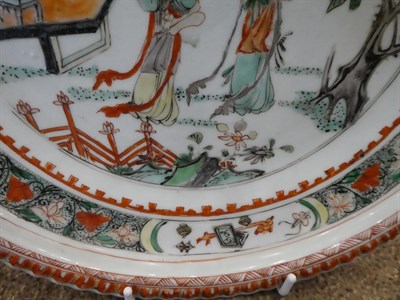 Lot 44 - A Chinese Porcelain Charger, Kangxi, painted in famille verte enamels with figures in a fenced...
