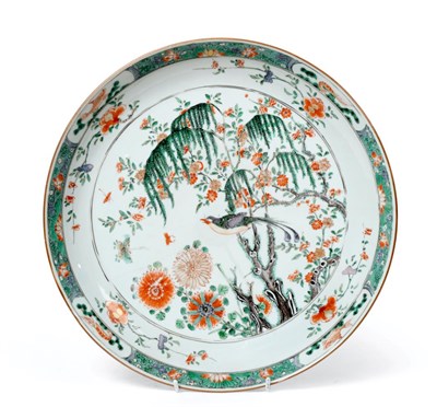 Lot 45 - A Chinese Porcelain Charger, Kangxi, painted in famille verte enamels with a bird perched in a tree