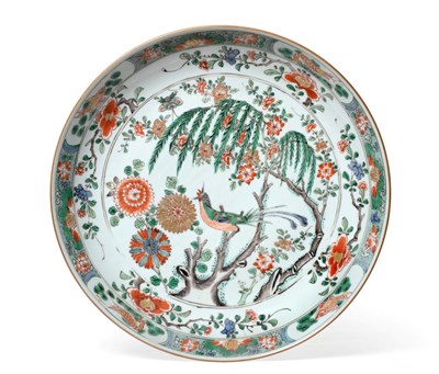 Lot 53 - A Chinese Porcelain Charger, Kangxi, painted in famille verte enamels with a bird perched in a tree