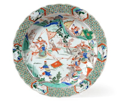 Lot 54 - A Chinese Porcelain Dish, Kangxi, painted in famille verte enamels with a battle scene within a...