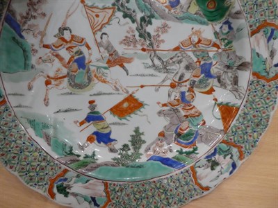 Lot 54 - A Chinese Porcelain Dish, Kangxi, painted in famille verte enamels with a battle scene within a...