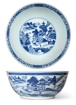Lot 63 - A Chinese Porcelain Punch Bowl, early 19th century, painted in underglaze blue with river...