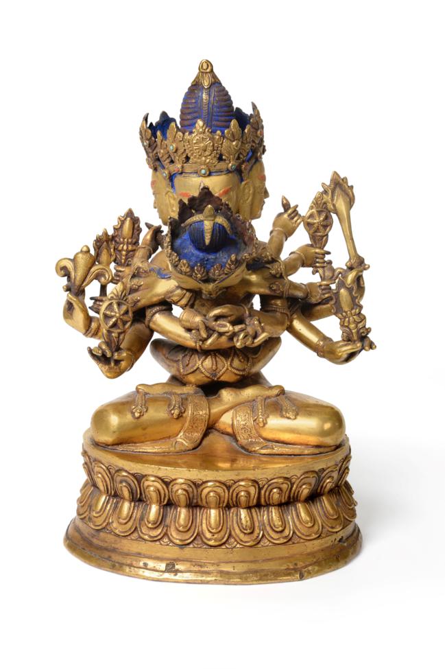 Lot 69 - A Tibetan Gilt-Bronze Figure of Guhyasamaja Akshobhyavajra and Consort, 18th century, the...