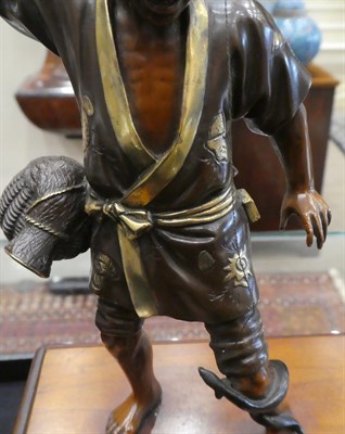 Lot 80 - A Japanese Gilt and Patinated Bronze Figure of a Fisherman, Meiji period, in the manner of...
