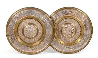 Lot 230 - A Pair of Elkington Style Parcel Gilt Electro-Type Chargers, after the design by Leonard...