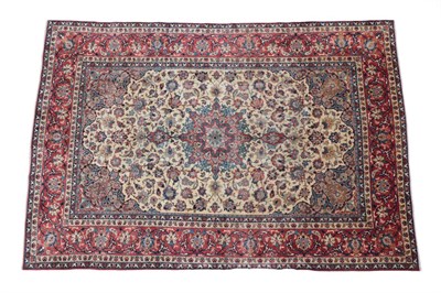 Lot 238 - Isfahan Carpet Central Iran, circa 1965 The cream field of scrolling vines and palmettes around...