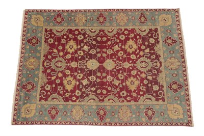 Lot 247 - Good Agra Carpet Central India, 20th century The abrashed aubergine field with an all over...