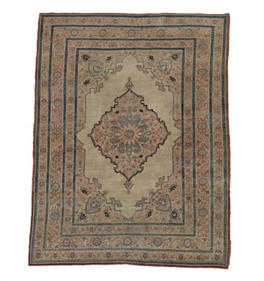 Lot 250 - Tabriz Haji Jalili Rug North West Iran, circa 1890 The plain cream field centred by a flower...