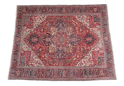 Lot 254 - Heriz Carpet North West Iran, circa 1920 The blood red field of angular vines and stylised...