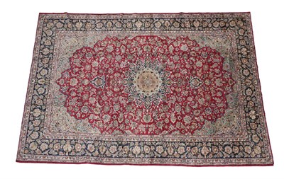 Lot 257 - Tabriz Carpet North West Iran, circa 1960 The blood red field of vines and palmettes around an...