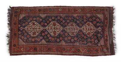 Lot 259 - Fars Rug South West Iran, circa 1910 The indigo field of numerous flowerheads surrounding four...