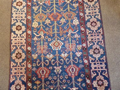 Lot 263 - Kurdish Runner Iranian Kurdistan, circa 1910 The midnight blue field with columns of polychrome...