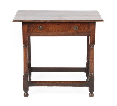 Lot 271 - An Early 18th Century Oak Side Table, the moulded top above a single frieze drawer, on turned...