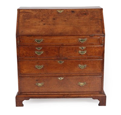 Lot 273 - A George III Burr Elm Bureau, 2nd half 18th century, the fall enclosing a fitted interior of pigeon