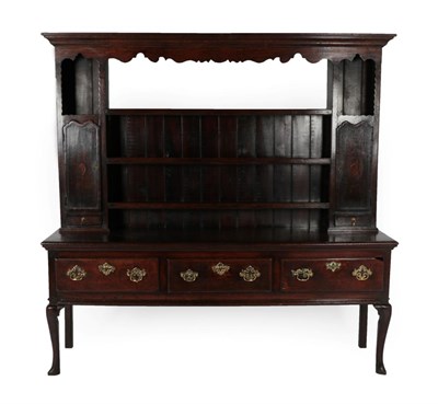 Lot 274 - A George III Oak Dresser and Rack, late 18th century, the upper section with a bold cornice above a