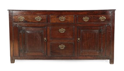 Lot 275 - An Early 18th Century Joined Oak Enclosed Dresser, with three real long drawers above two dummy...