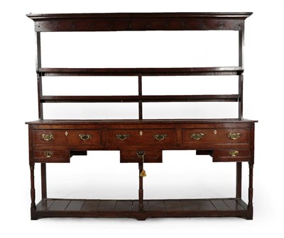 Lot 277 - A George III Oak Open Dresser and Rack, 3rd quarter 18th century, the moulded cornice above two...