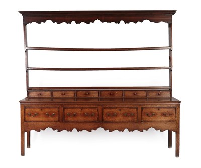 Lot 279 - An Oak and Mahogany Crossbanded Dresser and Rack, the rack with wavy shaped apron and three...