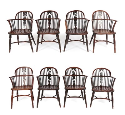 Lot 290 - A Matched Set of Eight Yew Windsor Armchairs, mid 19th century, with double spindle back...