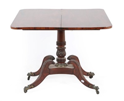 Lot 309 - A Regency Mahogany Foldover Tea Table, early 19th century, the hinged leaf above a gadrooned...