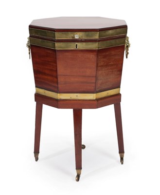 Lot 312 - A George III Mahogany and Brass Bound Octagonal Cellaret, circa 1800, the hinged lid enclosing...