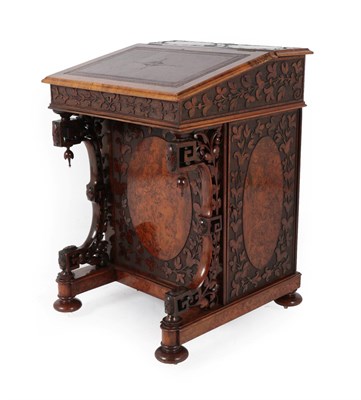 Lot 325 - A Victorian Burr Walnut and Carved Davenport, circa 1870, with gilded leather writing surface...